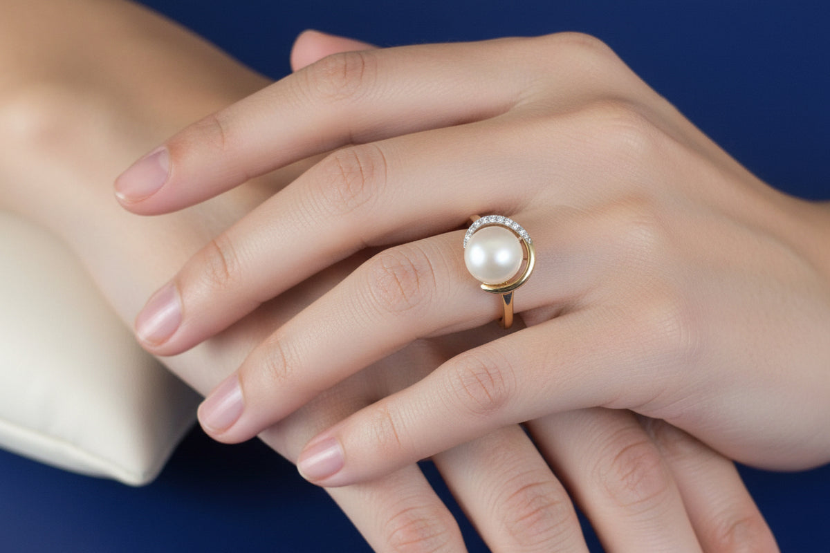 9ct yellow gold pearl and diamond knot dress ring worn on finger - for illustration purposes only