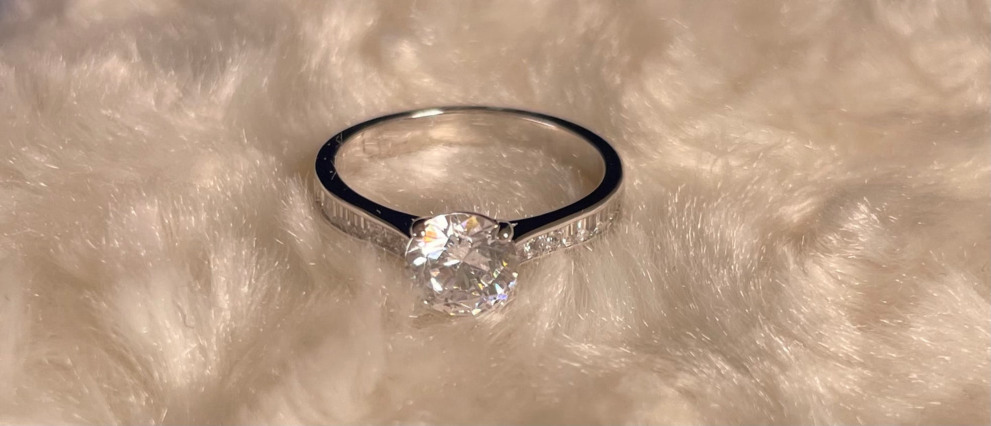 Brilliant Cut Cubic Zirconia Solitaire With Baguette CZ on Shoulder Rhodium Plated