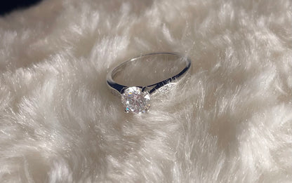 Rhodium-Plated Silver Brilliant Cut Cubic Zirconia Solitaire With Cubic Zirconia On Shoulder
