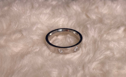 Flat Court Band with three Princess Cut Cubic Zirconicas Ring