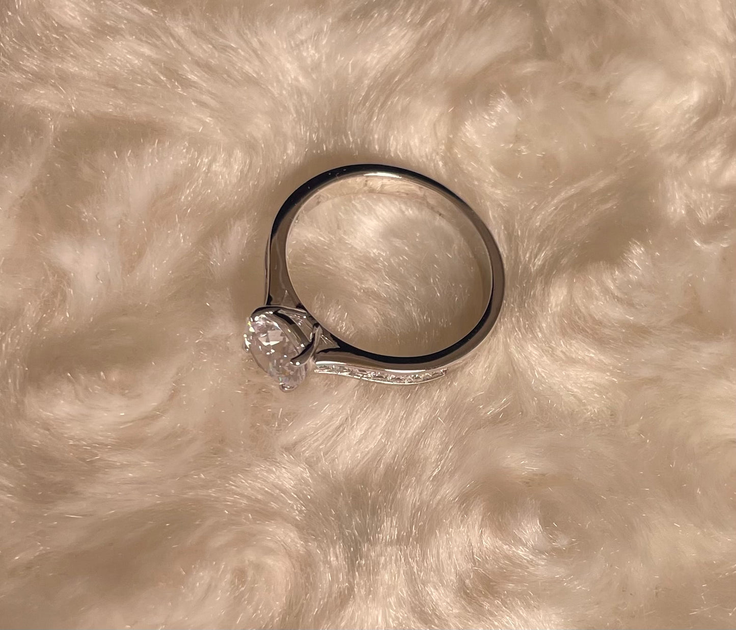 Rhodium-Plated Silver Brilliant Cut Cubic Zirconia Solitaire With Baguette CZ on Shoulder