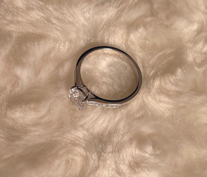 Rhodium-Plated Silver Brilliant Cut Cubic Zirconia Solitaire With Baguette CZ on Shoulder