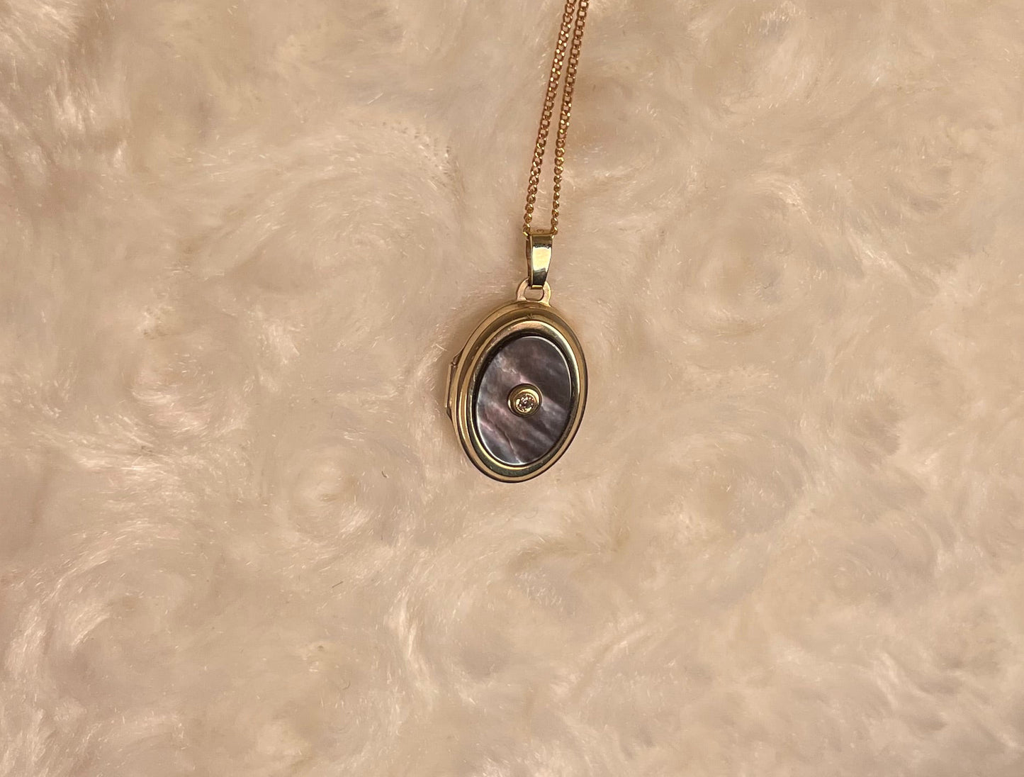 9ct Yellow Gold Grey Mother of Pearl Oval Locket With Small Diamond Centre