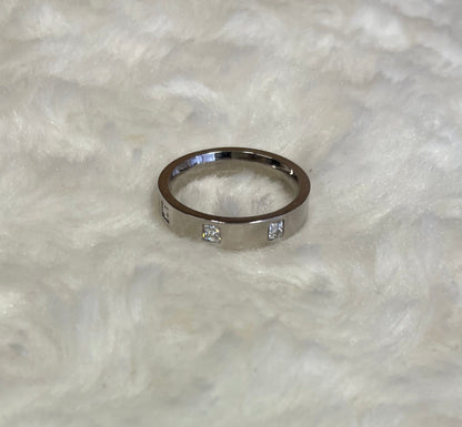 Rhodium-Plated Silver Flat Court Band with Three Princess Cut Cubic Zirconica Ring