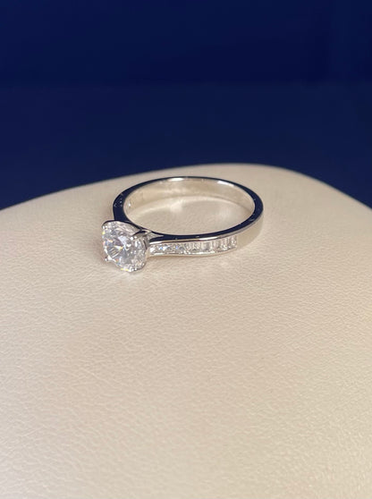 Rhodium-Plated Silver Brilliant Cut Cubic Zirconia Solitaire With Baguette CZ on Shoulder