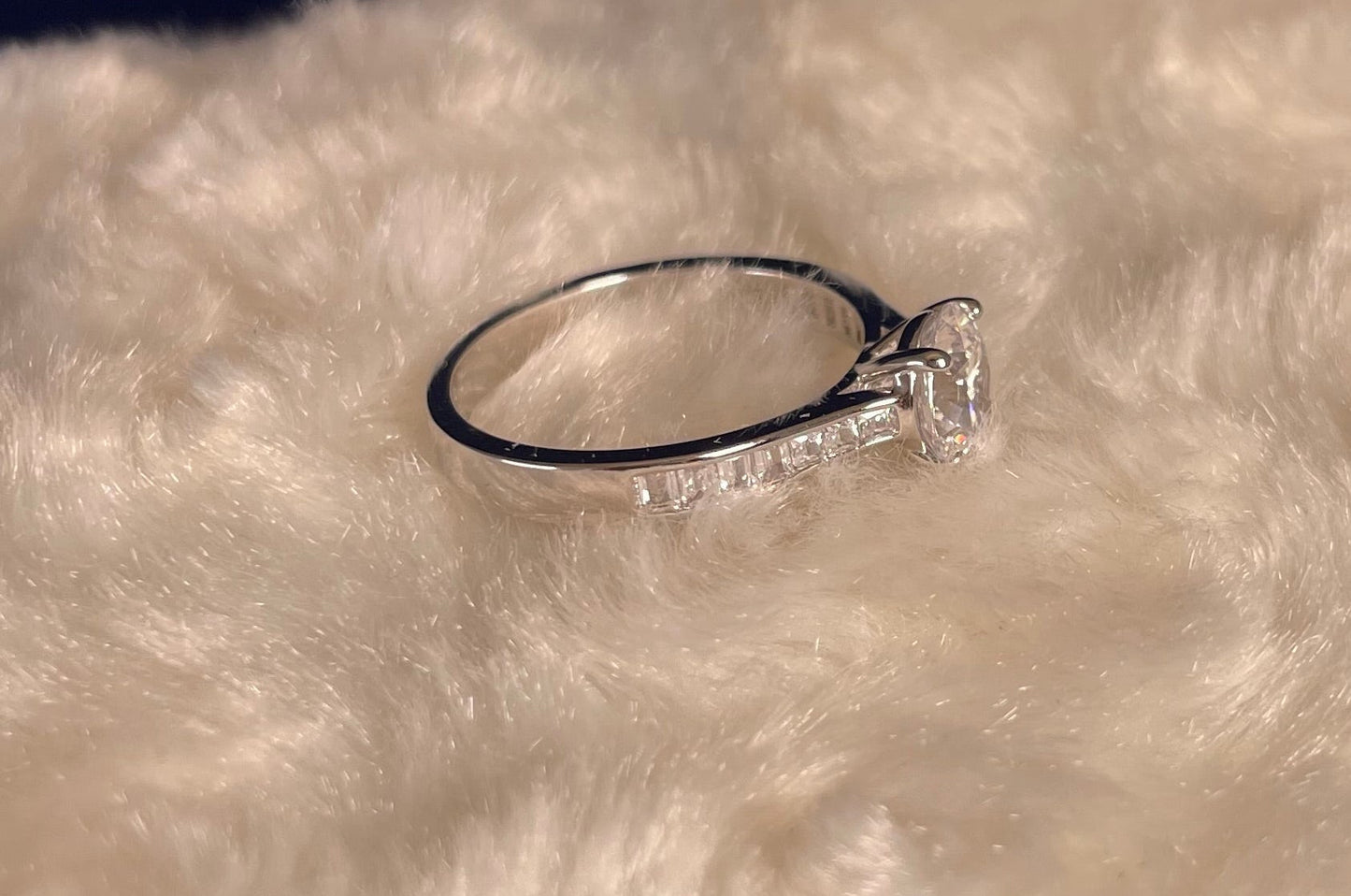 Rhodium-Plated Silver Brilliant Cut Cubic Zirconia Solitaire With Baguette CZ on Shoulder