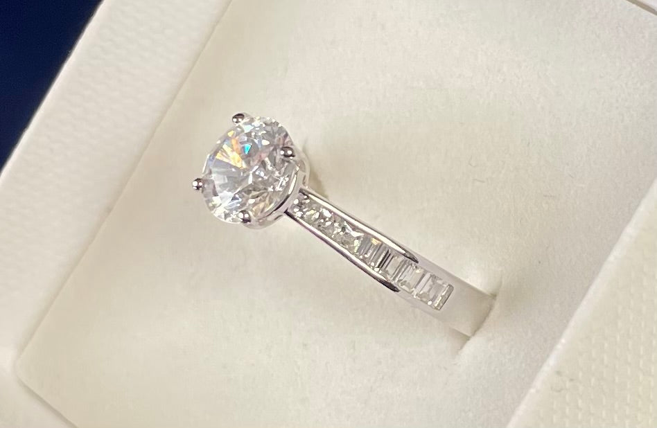 Brilliant Cut Cubic Zirconia Solitaire With Baguette CZ on Shoulder Rhodium Plated