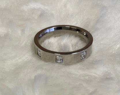 Flat Court Band with three Princess Cut Cubic Zirconicas Ring