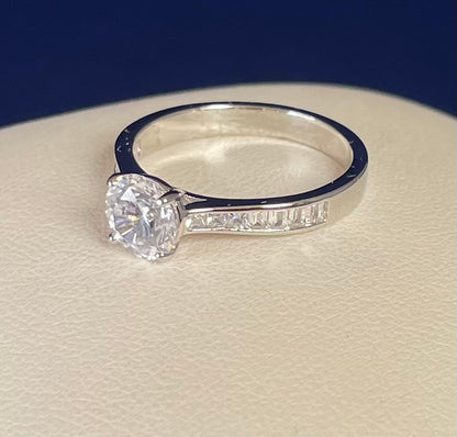 Brilliant Cut Cubic Zirconia Solitaire With Baguette CZ on Shoulder Rhodium Plated