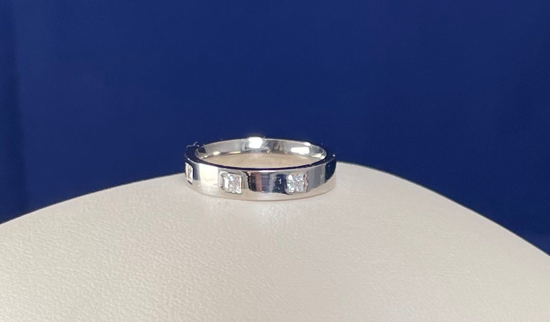 Flat Court Band with three Princess Cut Cubic Zirconicas Ring
