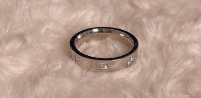 Flat Court Band with three Princess Cut Cubic Zirconicas Ring