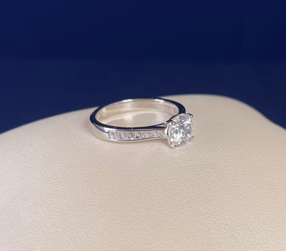 Rhodium-Plated Silver Brilliant Cut Cubic Zirconia Solitaire With Baguette CZ on Shoulder