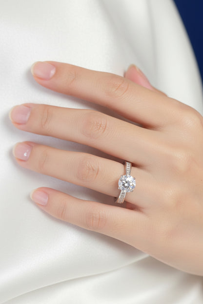 Rhodium-Plated Silver Brilliant Cut Cubic Zirconia Solitaire With Baguette CZ on Shoulder