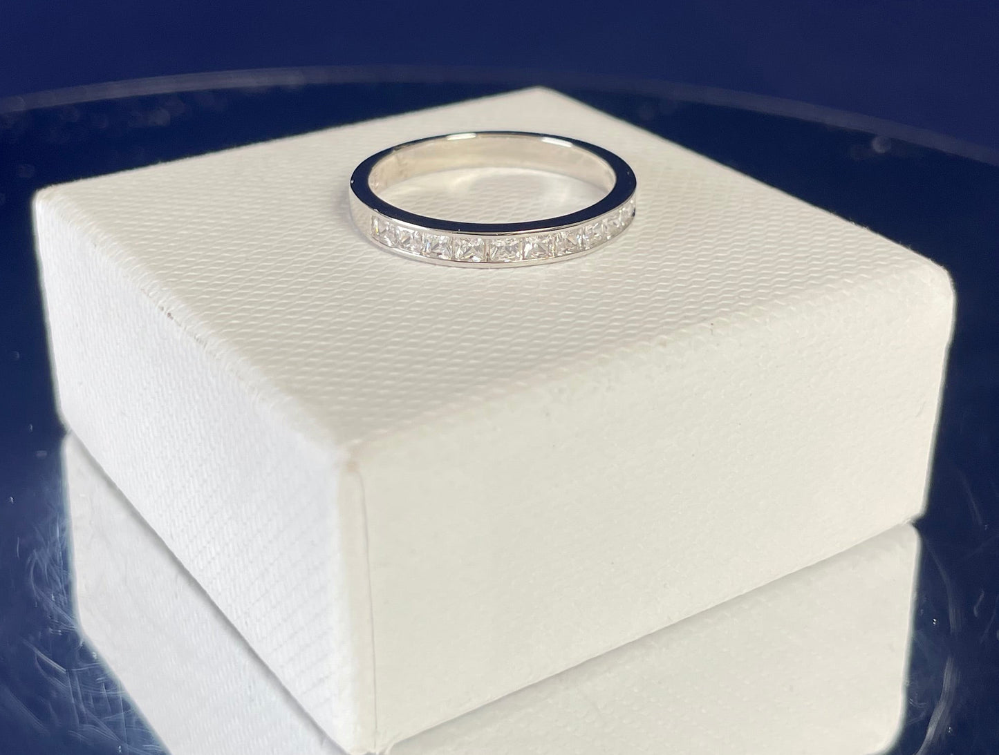 Half Eternity Channel Set Princess Cut Cubic Zirconia Rhodium Plated